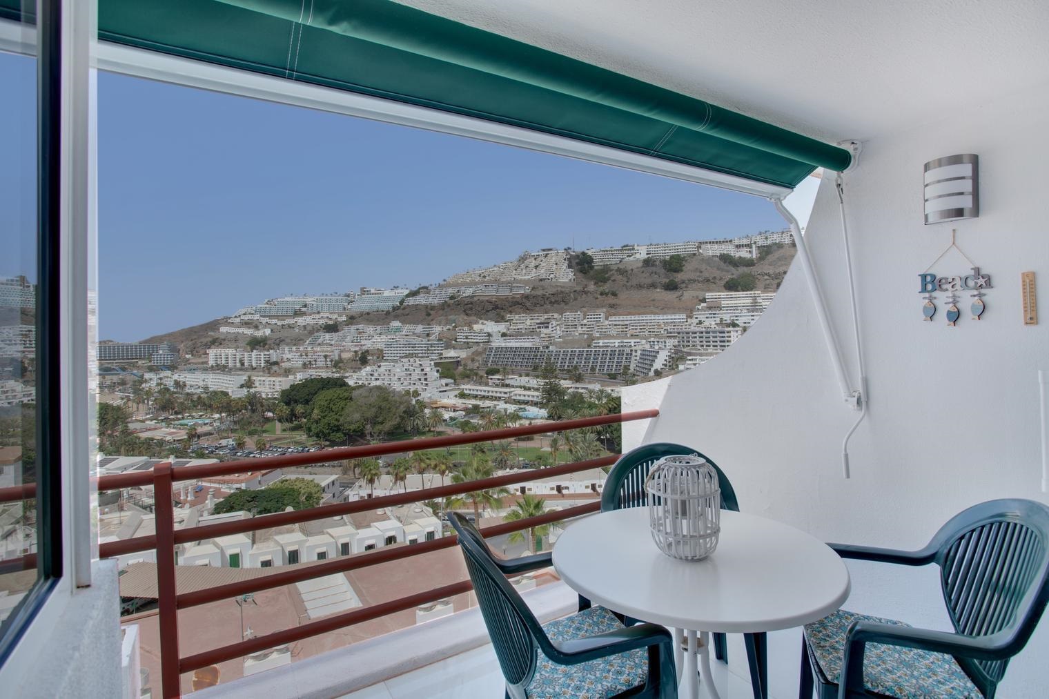 Balcony seating with a sea view at sunset